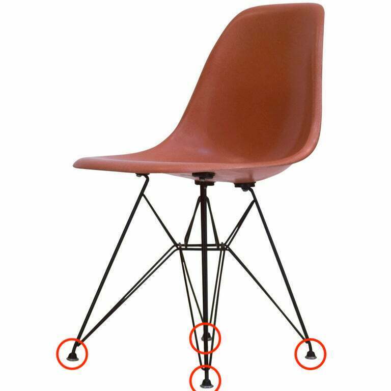 Rust-colored Eames or Virta Eiffel Tower base chair with replacement feet/glides fitted to the ball-style legs